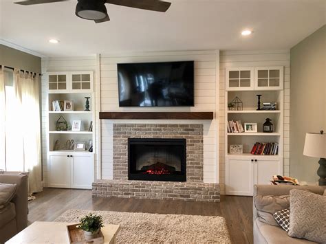 Shiplap fireplace wall | Built in around fireplace, Built in shelves living room, Fireplace ...