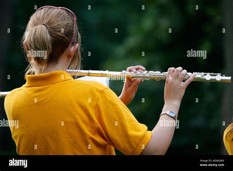 Flute player in a high school marching band Stock Photo - Alamy