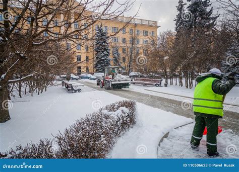 Tractor Cleaning the Road from the Snow. Excavator Cleans the St Editorial Stock Photo - Image ...