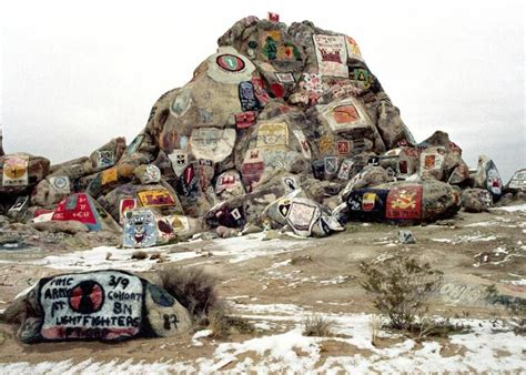 Fort Irwin's famed Rock Pile. Units that have trained here for decades have added their insignia ...