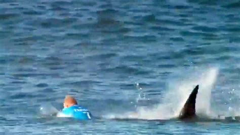 3-time world champ Fanning escapes shark attack during surfing competition in South Africa | CTV ...