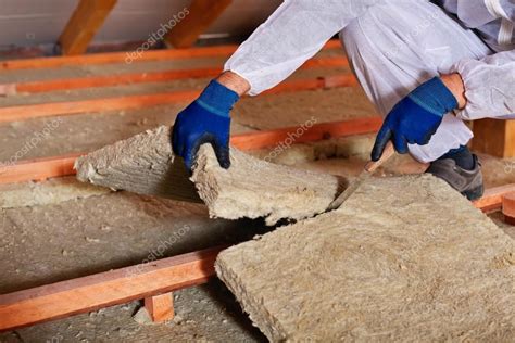 Installing thermal insulation layer - closeup on hands — Stock Photo © lightkeeper #62677169