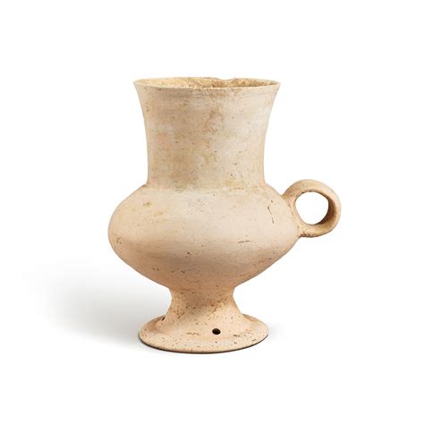 A white pottery goblet, Dawenkou culture, 4300-2400 B.C. 大汶口文化 白陶高腳盃 ...