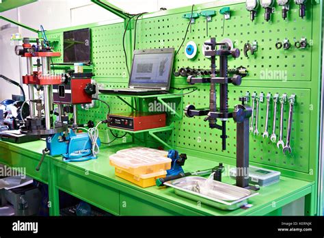 Worktable with tools in a car repair shop Stock Photo - Alamy