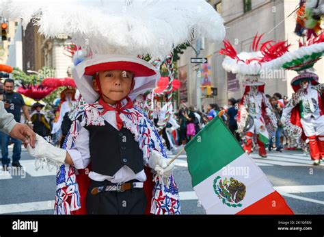 A young participant is seen holding Mexican flag at the annual Mexican ...