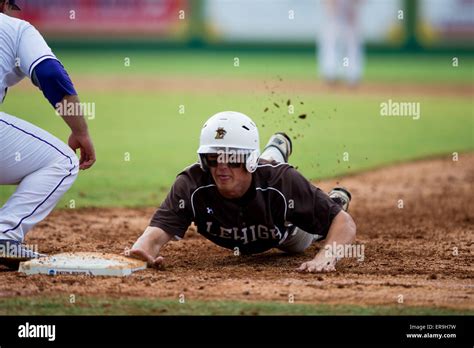 Rouge, LA, USA. 29th May, 2015. Lehigh Mountain Hawks shortstop John Elson (6) slides into ...