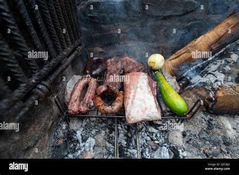 Typical Uruguayan and Argentine Asado Cooked on fire. Entrana and Vacio ...