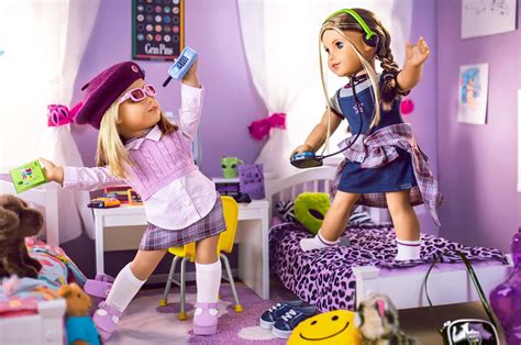 Download Two American Girl Dolls In A Purple Bedroom | Wallpapers.com