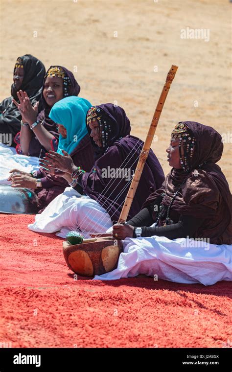 Africa, Western Sahara, Dakhla. Women in traditional dress singing and playing instruments Stock ...