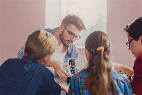 Stem Education. Kids Creating Robots with Teacher Stock Photo - Image of education, invention ...