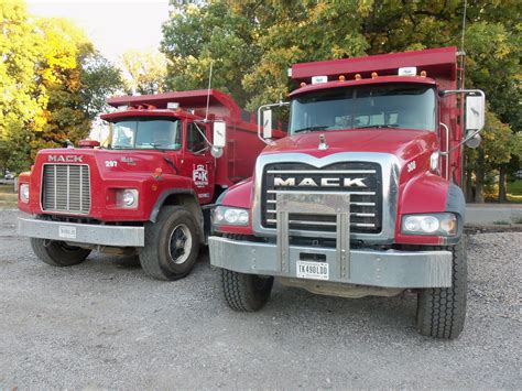 2 red Mack dump trucks at the corner of Elm St & Northwestern.This ...