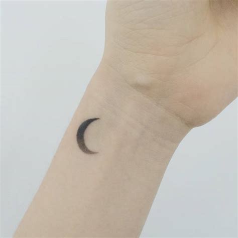 Tiny crescent moon tattoo - Tattoogrid.net