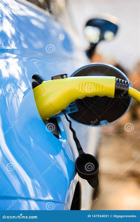 Charging Electric Car with Power Cable Supply Plugged in Stock Image ...