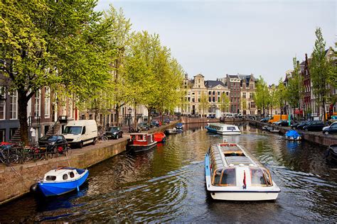 Boats on Canal Tour in Amsterdam Photograph by Artur Bogacki - Pixels