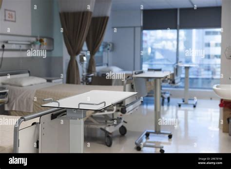 General view of patient room with beds and medical equipment at ...