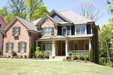 Brick House with Porch stock photo. Image of tree, blue - 5165038