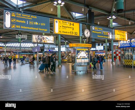 Information signs and people in train terminal of Schiphol Amsterdam Airport, Netherlands Stock ...