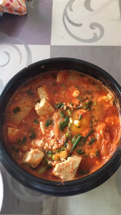 Sundubu-jjigae (순두부찌개) Spicy soft tofu stew with kimchi and pork belly recipe - Maangchi.com