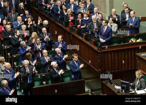 New Polish Prime Minister Mateusz Morawiecki is applauded by lawmakers after giving his policy ...