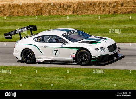 Bentley Continental GT3-R racing car driving up the hill climb track at ...