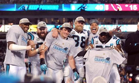 Panthers celebrate following the team's 49-15 victory over the Arizona Cardinals in the NFC ...