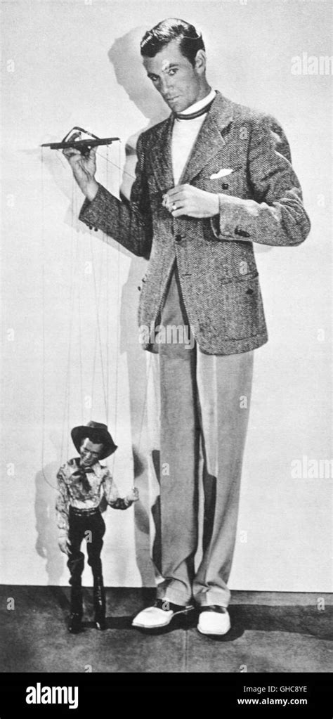 GARY COOPER playing with puppet (1930er Stock Photo - Alamy