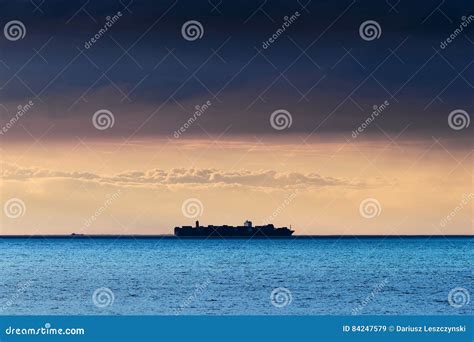 Silhouette of Large Container Ship Crossing Baltic Sea Under Dramatic Dark Nimbostratus Cloud ...