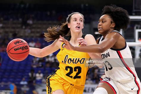 Caitlin Clark of the Iowa Hawkeyes drives against Christyn Williams ...