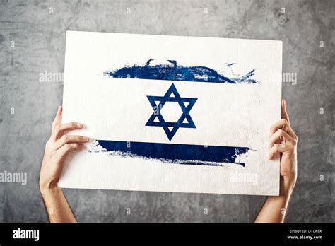 Israel flag. Man holding banner with Israelian Flag. Supporting national team, patriotism ...