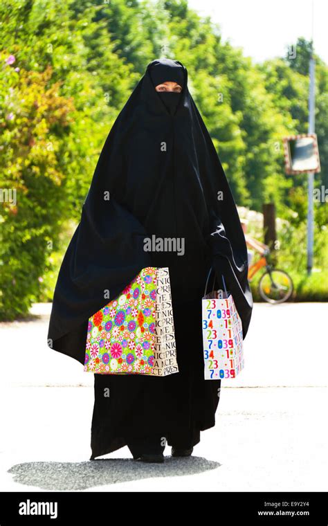 symbol photo islam. Muslim with burka Stock Photo - Alamy