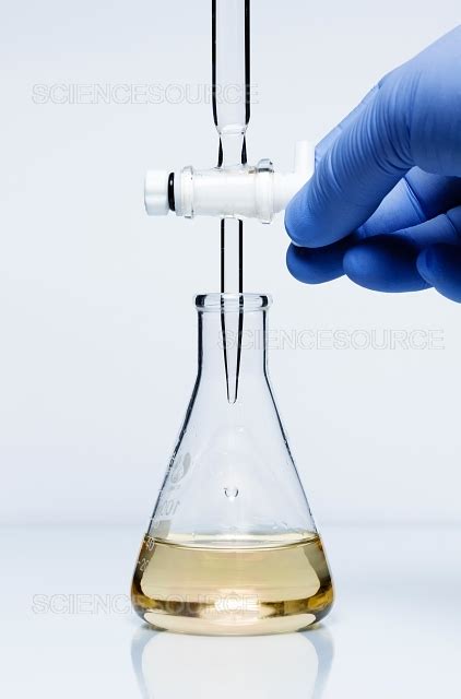 Photograph | Titration of sodium hydroxide with hyd | Science Source Images