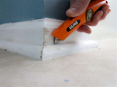 How to remove baseboards from behind tile