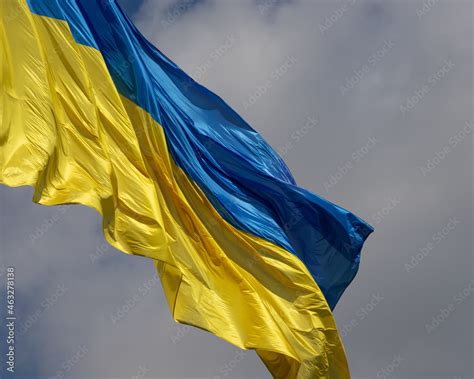 Ukraine flag waving on the wind against the blue sky Stock Photo ...