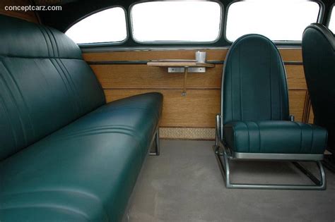 the interior of an old bus with green leather seats