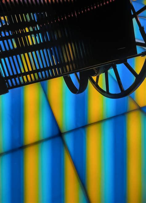 A black bench sitting under a colorful wall photo – Free Stuttgart ...