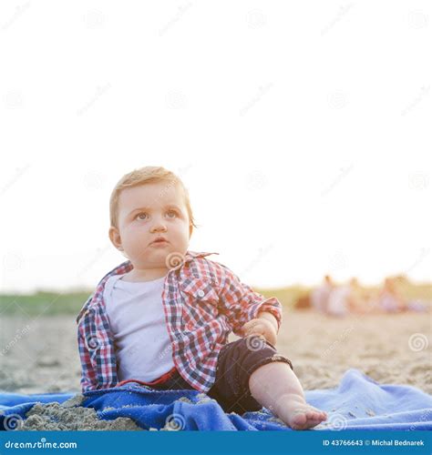 Handsome Curious Child Sitting on the Beach Looking at the Sky Stock Image - Image of curious ...