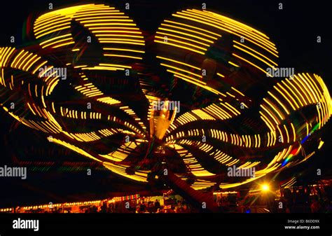 Fairground "Octopus" ride at night, Wiltshire, UK Stock Photo - Alamy