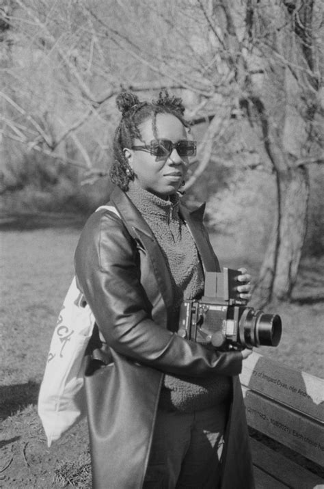 African American Photographer With Camera