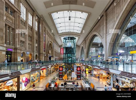 Train station Leipzig Hauptbahnhof Hbf in Germany Deutsche Bahn DB Halle shops stores Stock ...