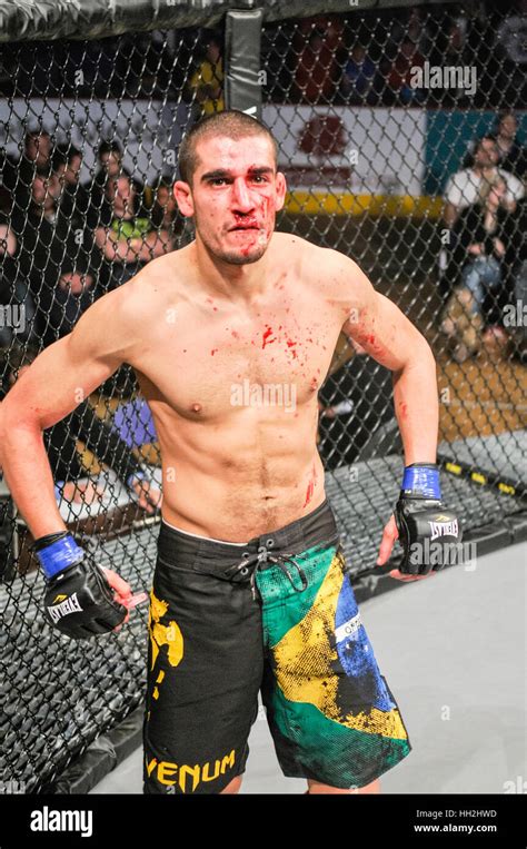 MMA cage fighter covered in blood after taking a punch to his nose, breaking it in the process ...