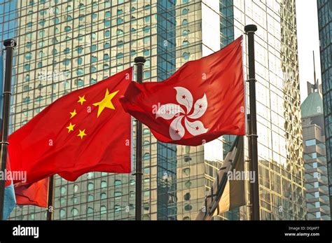 Flags of China and Hong Kong in front of an office building, Hong Kong ...