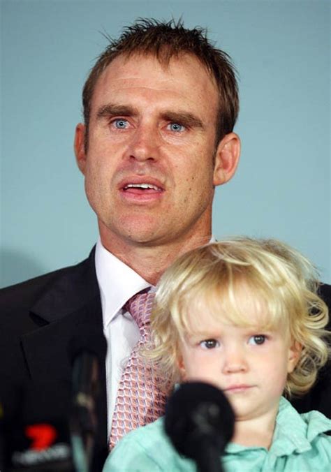 Matthew Hayden holds his son Thomas as he announces his retirement ...