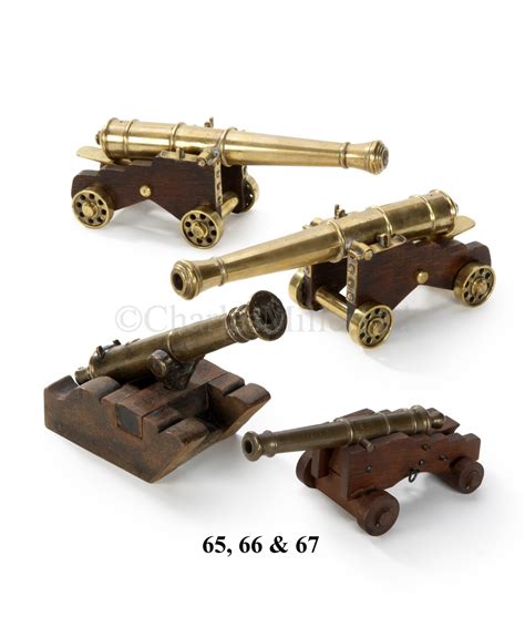 Lot 67 - A MODEL CANNON MADE FROM METAL RECOVERED FROM.