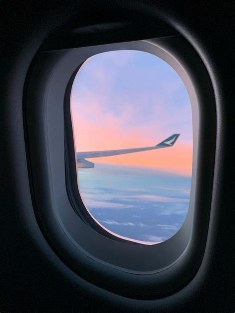 View Of The Clouds And Airplane Wing From The Aircraft Window · Free Stock Photo