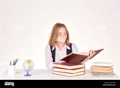 Girl studying at desk Stock Photo - Alamy