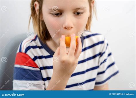 Fruity Munch: a Young Boy Munches on a Ripe Yellow Plum, Enjoying the Fruity Goodness in Every ...