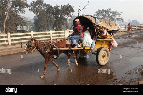 Birgunj, Nepal. 4th Dec, 2019. People travel in a cart to cross Nepal ...