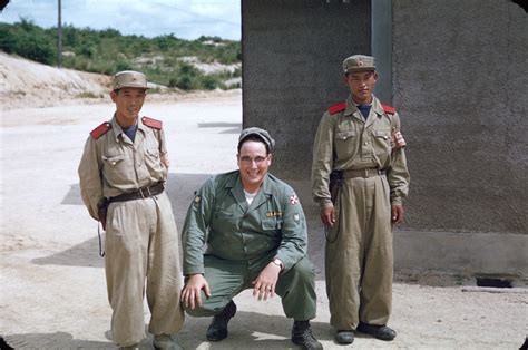 An American soldier poses with two North Korean soldiers at the Joint Security Area, Panmunjom ...