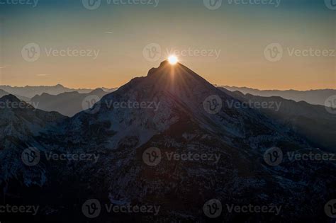 Sun rising behind the mountains 5708713 Stock Photo at Vecteezy