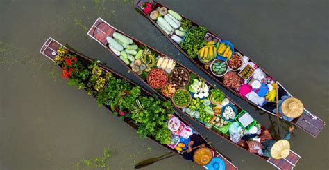 From Bangkok: Maeklong Railway and Floating Market Food Tour | GetYourGuide